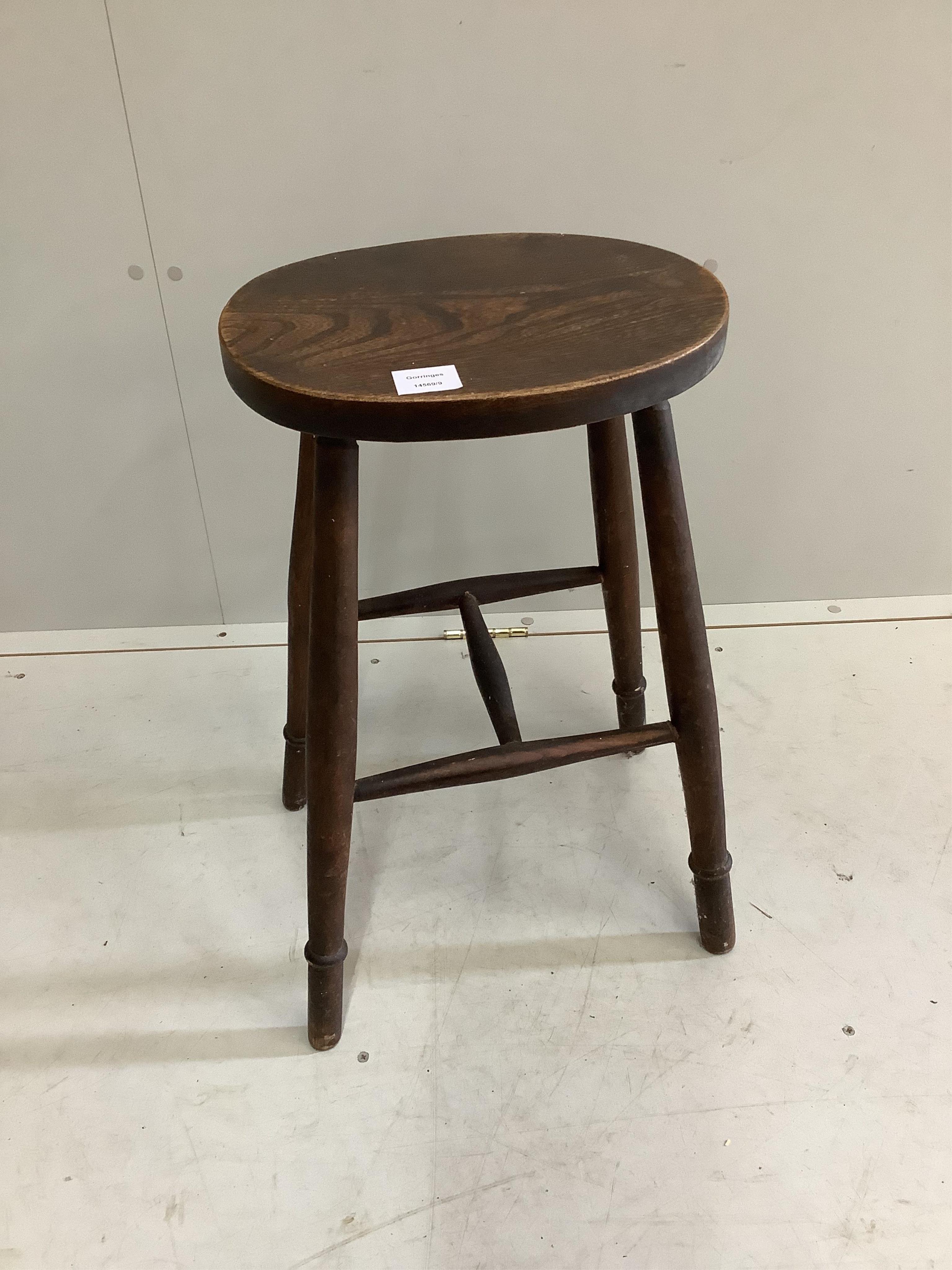 A Provincial elm and beech stool, width 35cm, height 61cm. Condition - fair